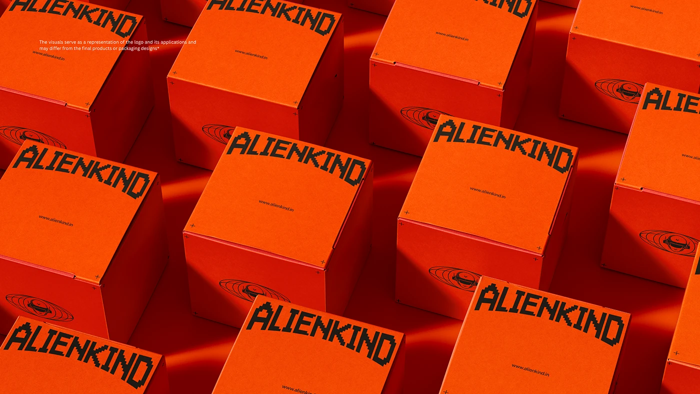 ALIENKIND orange shipping boxes stacked with branded wordmark
