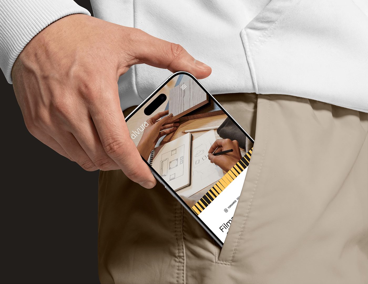 Alvura Filmes branding mobile web interface displayed on phone in pocket