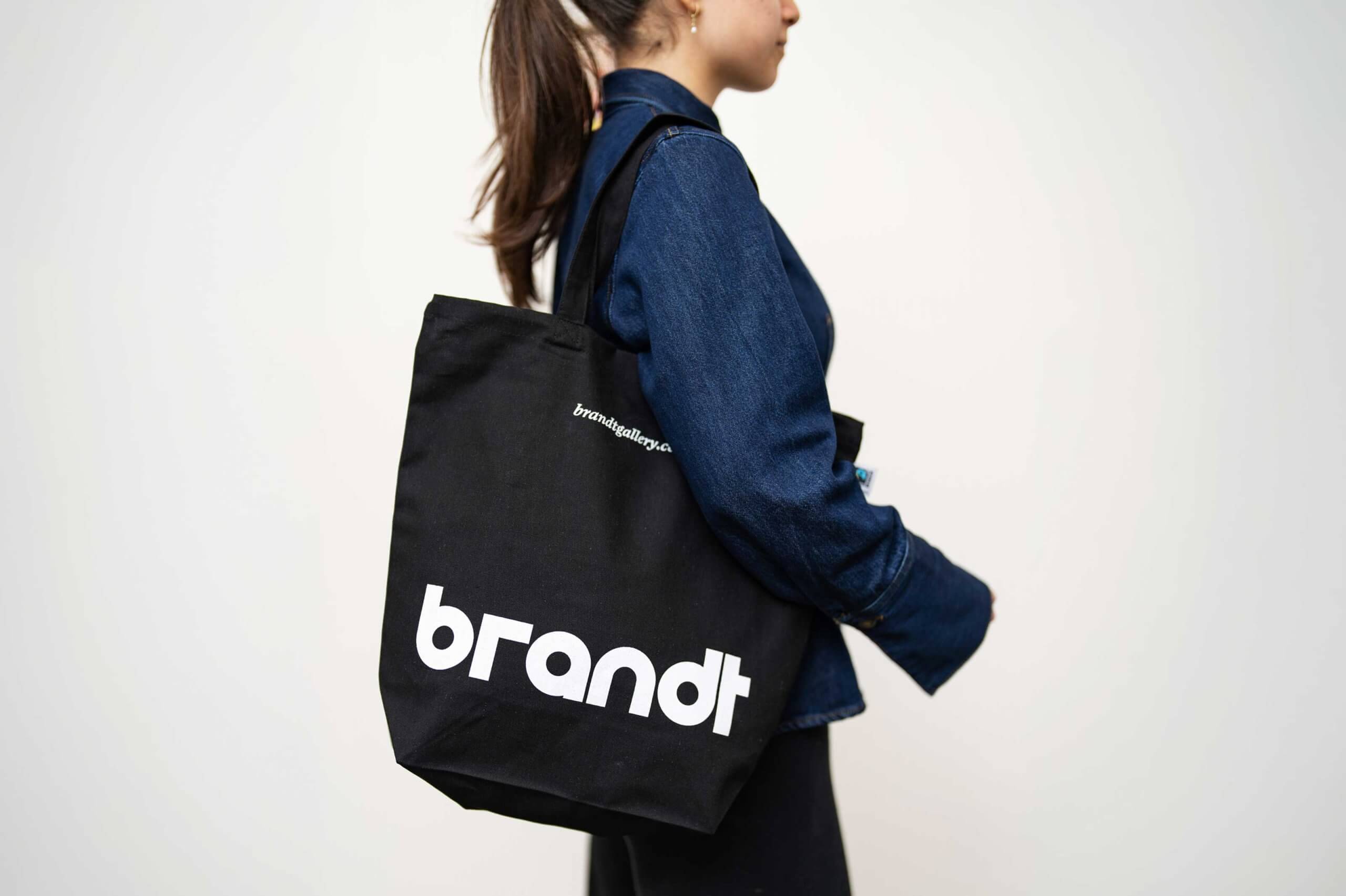 Black Brandt Gallery tote bag with the new brandt wordmark in white