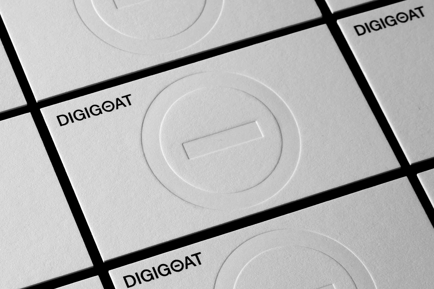 Digigoat branding debossed paper business card grid detail
