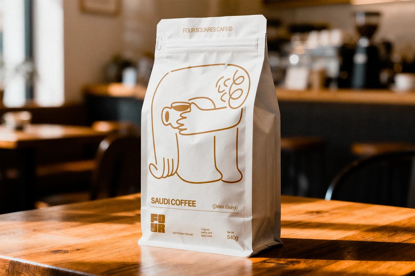 Four Squares Cafe coffee bag packaging with line-drawn mascot illustration