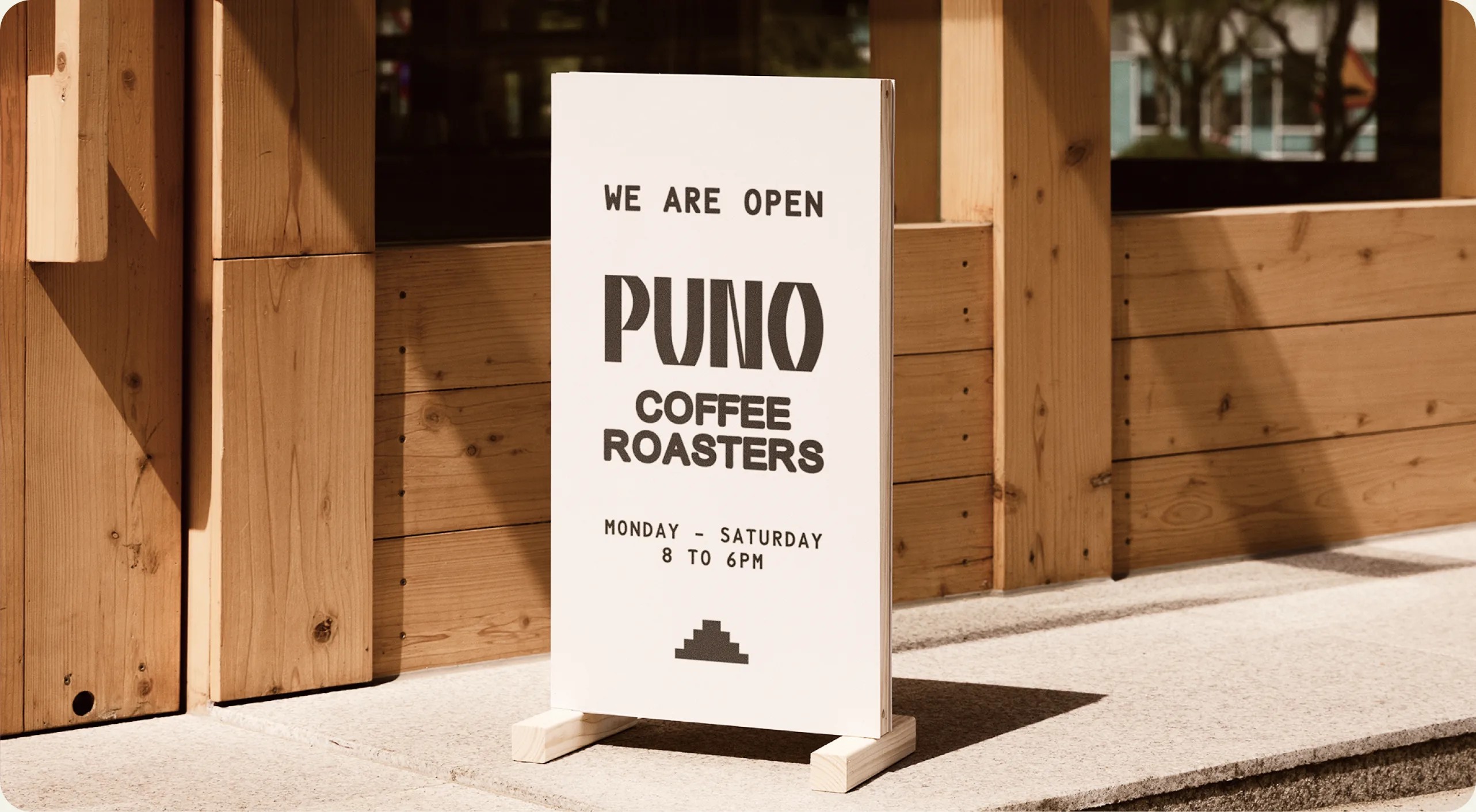 PUNO Coffee A-frame signage at the coffee shop entrance