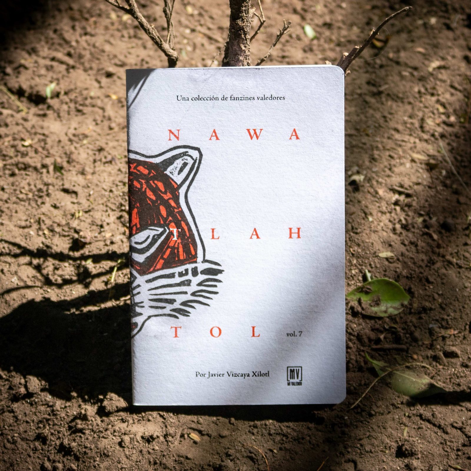 Fanzine 'Nawatlahtol' vol. 7 cover with wide-tracked serif title and jaguar linocut illustration