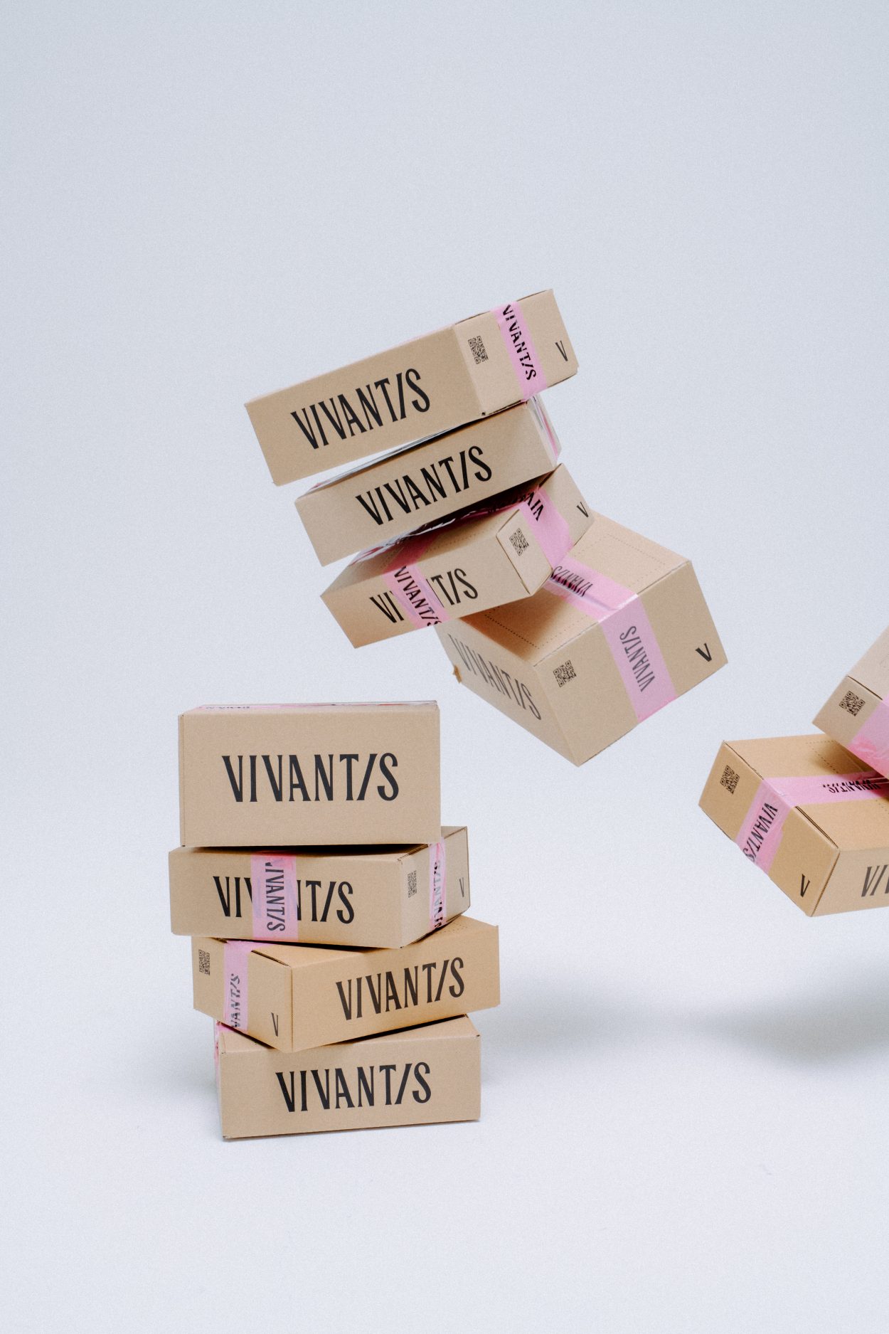 Vivantis branded boxes floating in a studio shoot
