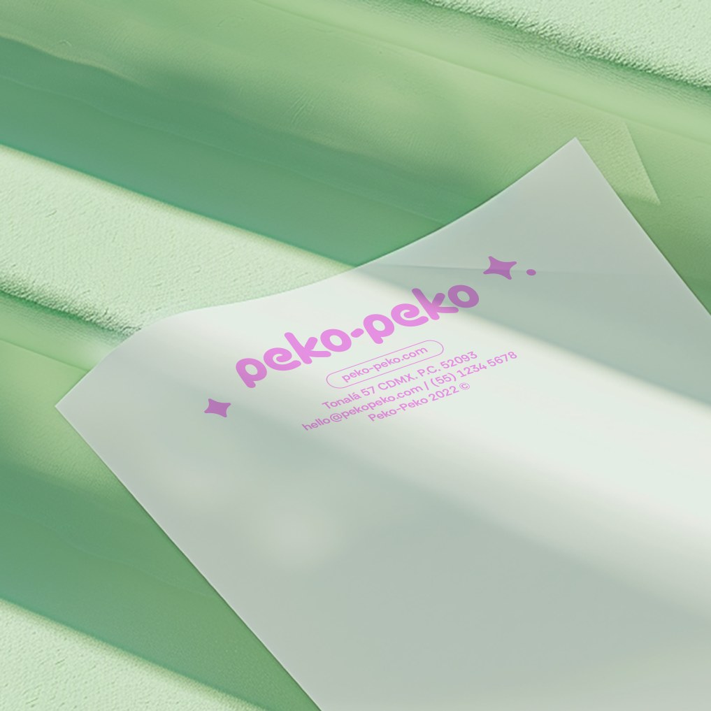 Peko-Peko letterhead with the pink wordmark on white paper against a green background