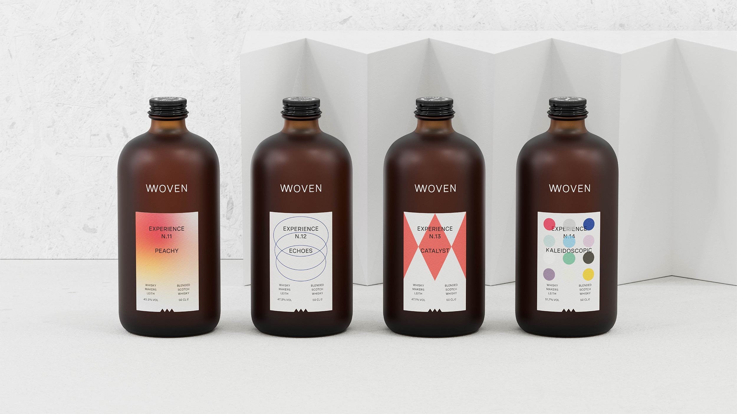 Four Woven limited edition bottles, Experience N.11 Peachy, N.12 Echoes, N.13 Catalyst and N.14 Kaleidoscopic, in a row.