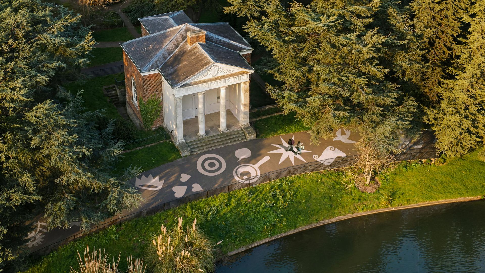 Brand icons painted on a path in Gunnersbury Park