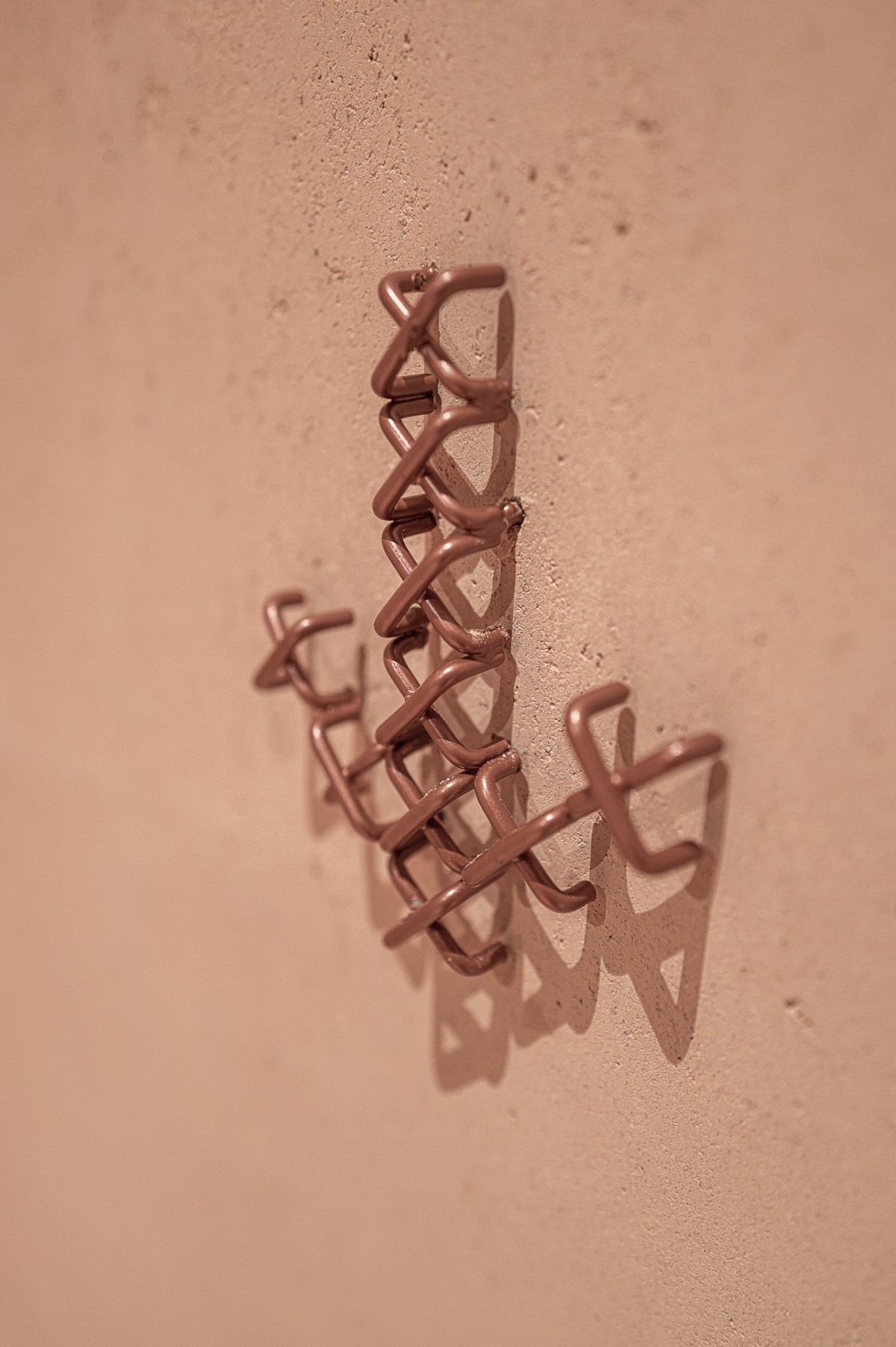 The main hall of Education Center Kössen with copper wayfinding by Atelier Andrea Gassner