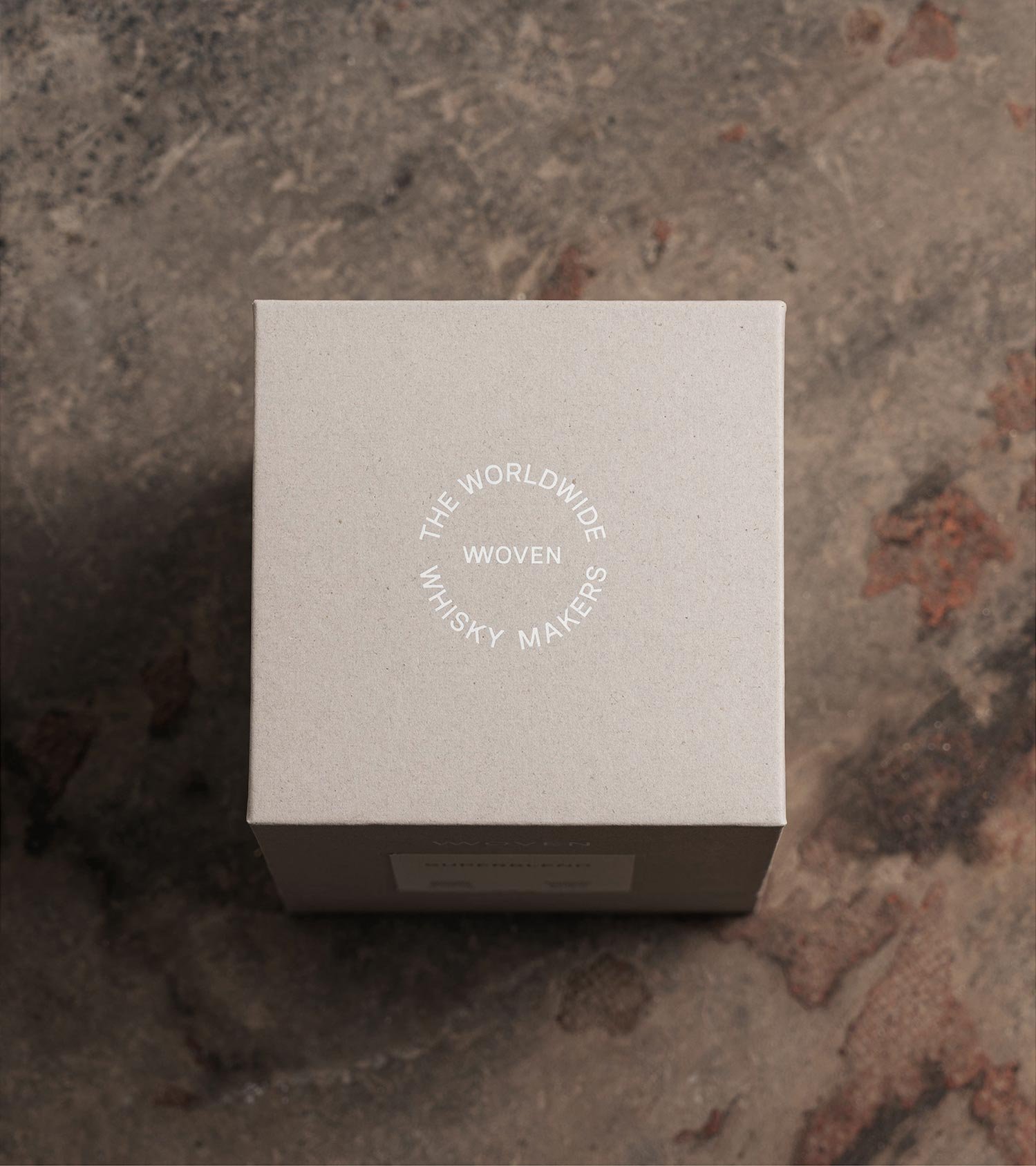 Top of a grey Woven box with a circular The Worldwide Whisky Makers lockup.