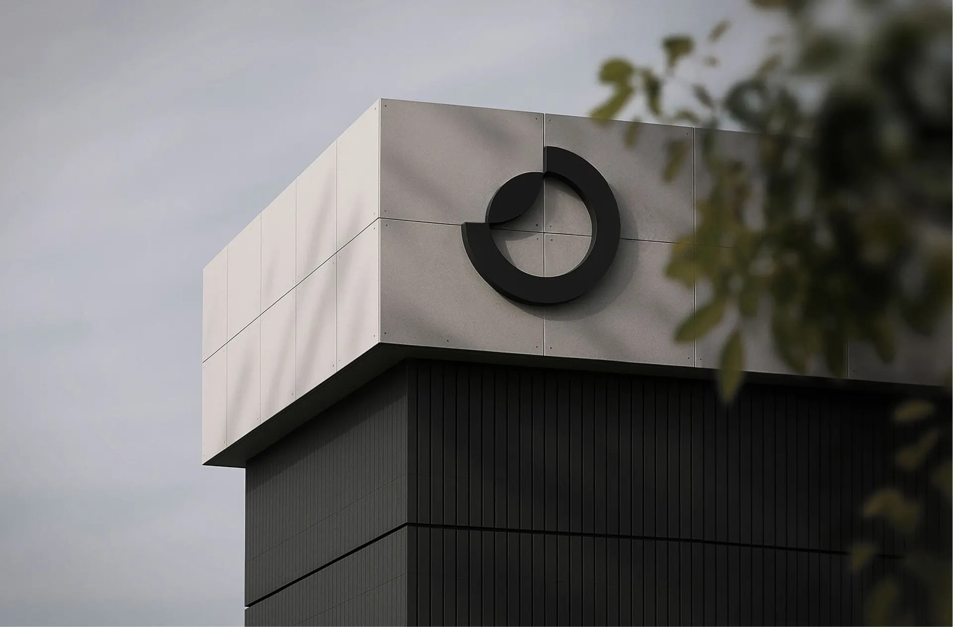 Osland circular mark as building signage on a concrete facade