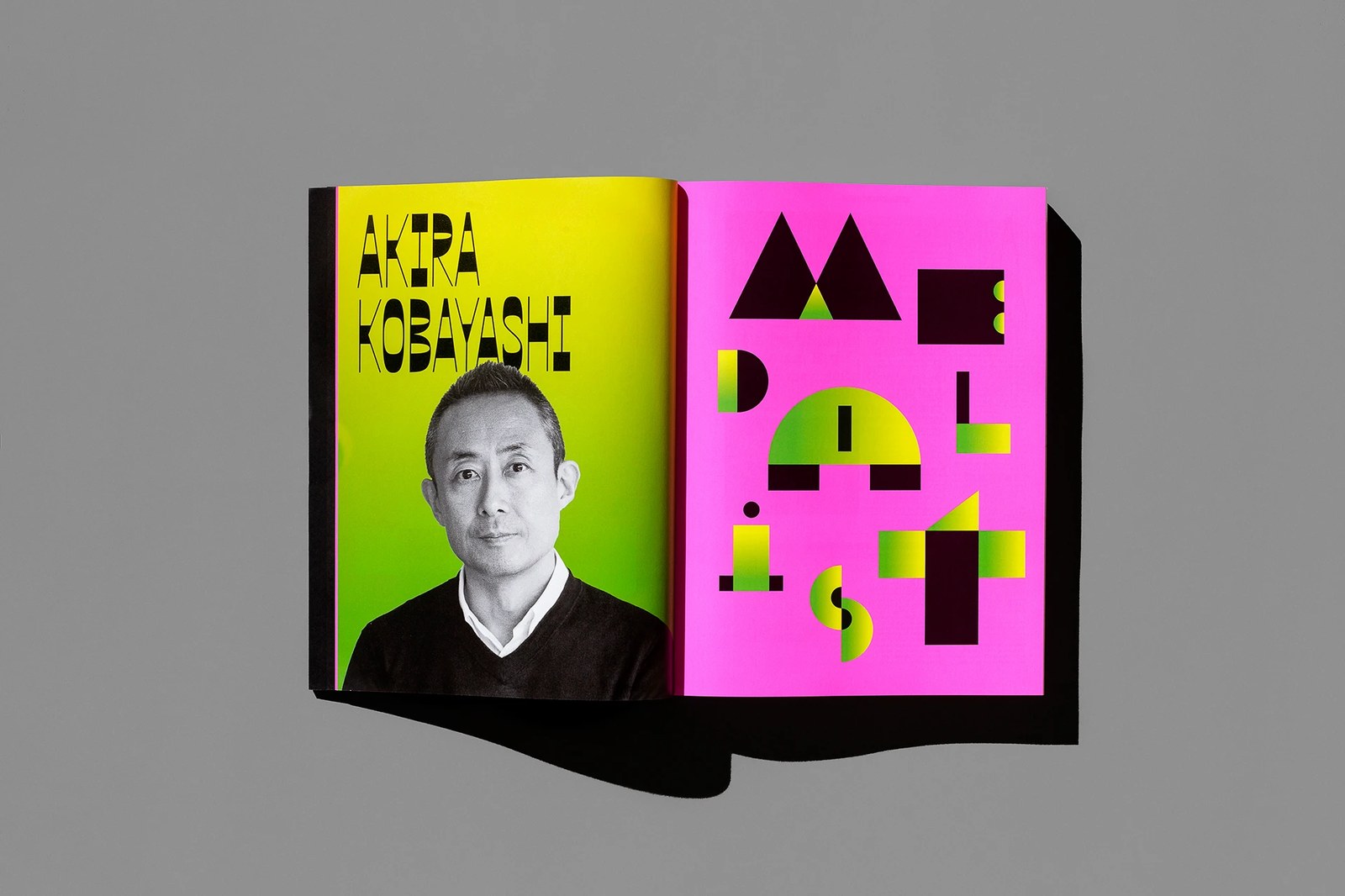 TDC Medalist Akira Kobayashi section opener spread pairing an acid-yellow portrait page with oversized MEDALIST geometric counterforms — editorial design by Tereza Bettinardi