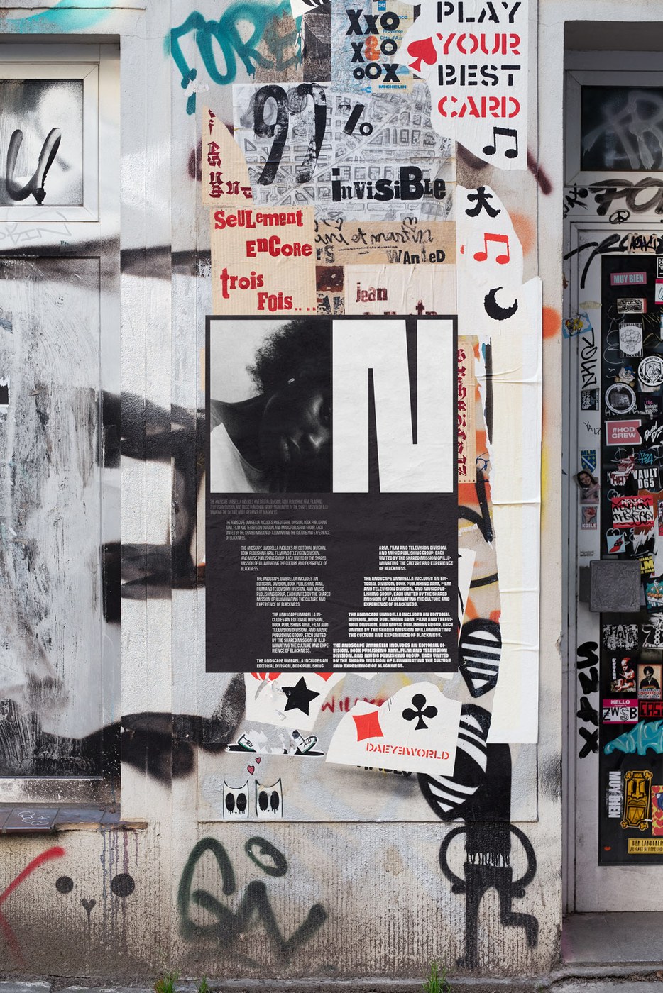 Urban poster wall with letter N framing editorial portrait in Andscape typography design