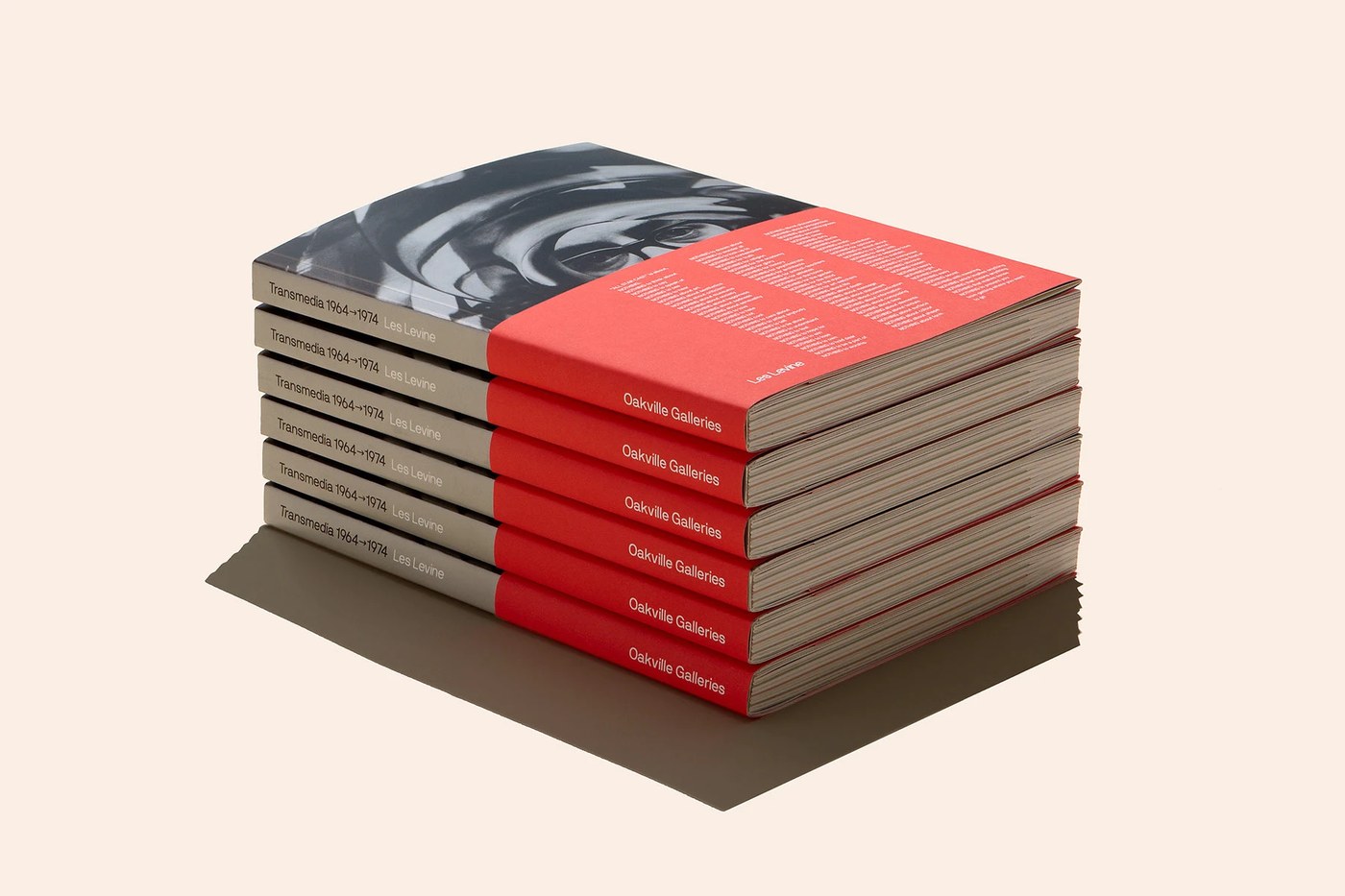 Tactile publication layout with reflective silver ink and translucent synthetic paper for Les Levine by Underline Studio
