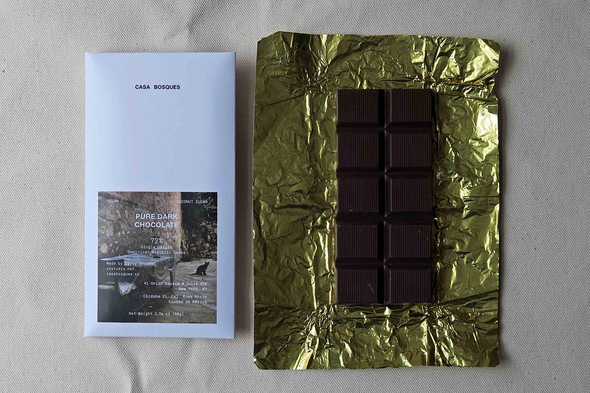 Pure Dark Chocolate packaging design sleeve and ridged chocolate bar on crumpled gold foil by SAVVY STUDIO