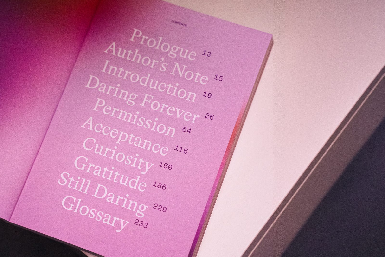 Contents page listing Prologue to Glossary over a pink gradient, Daring Forever book by Radim Malinic