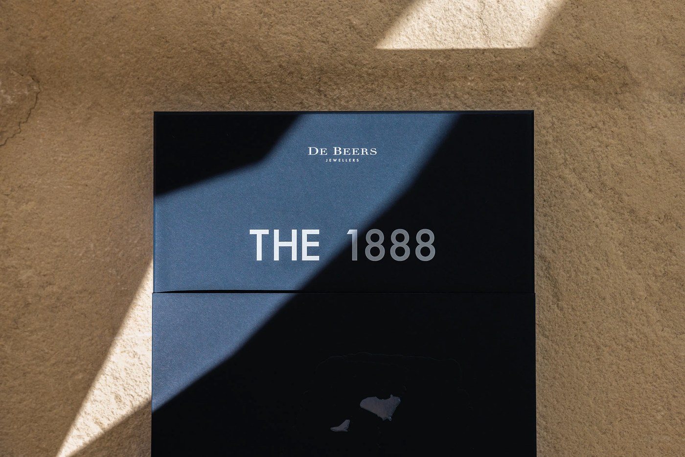 Silver foil De Beers Jewellers and The 1888 typography detail — branding by Two Times Elliott