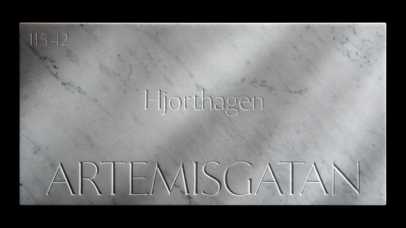 Artemisgatan street sign carved in white Carrara marble — typography by Letters from Sweden