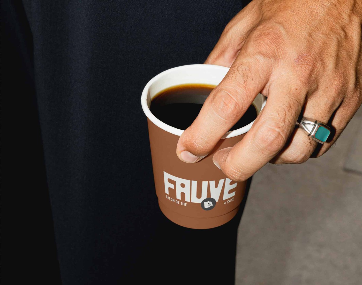 FAUVE brand identity takeaway coffee cup with embossed paper sleeve