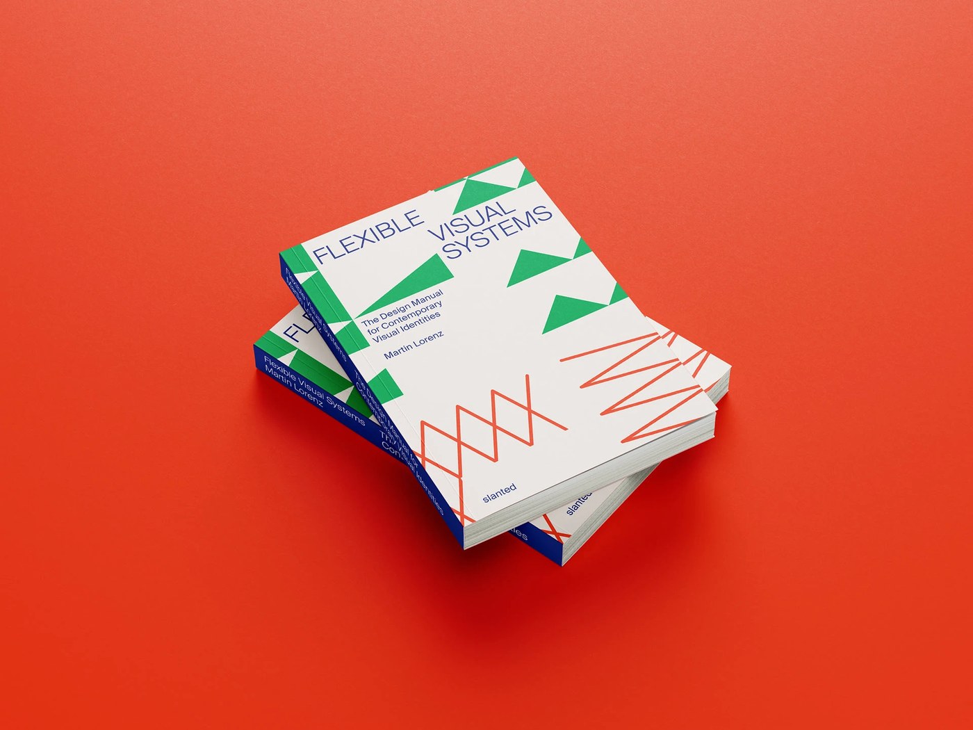Flexible Visual Systems softcover copies stacked on red background — editorial design by TwoPoints.Net