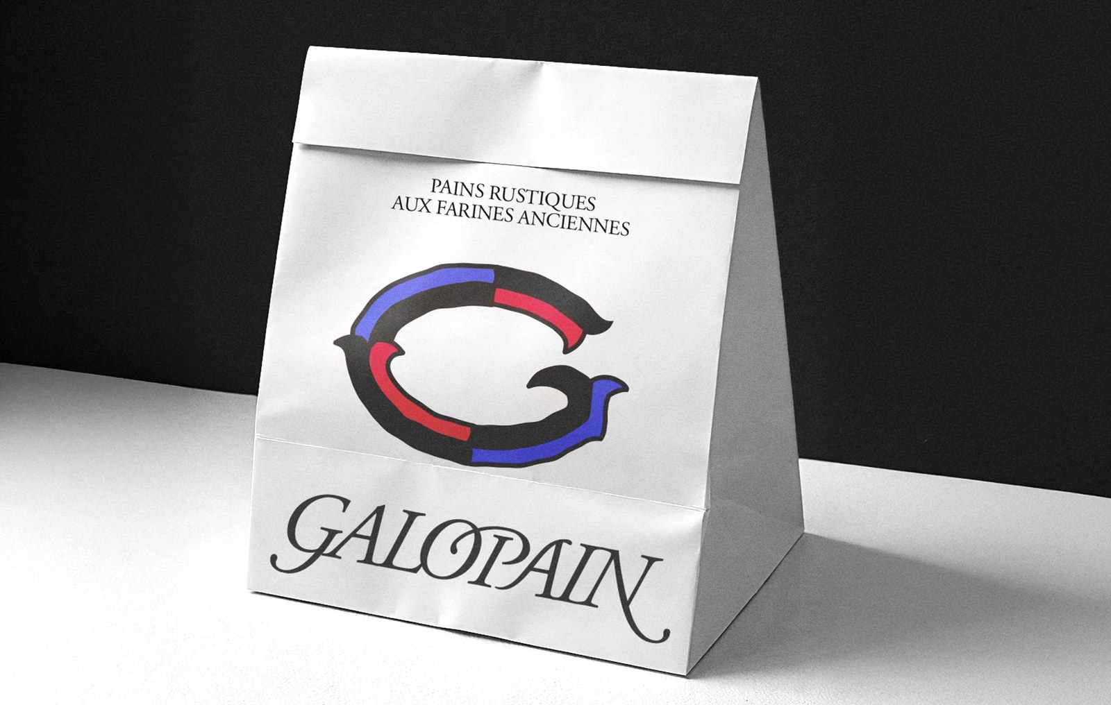White gusseted paper bread bag featuring the illuminated G emblem and italic wordmark — branding by Charline GROEN