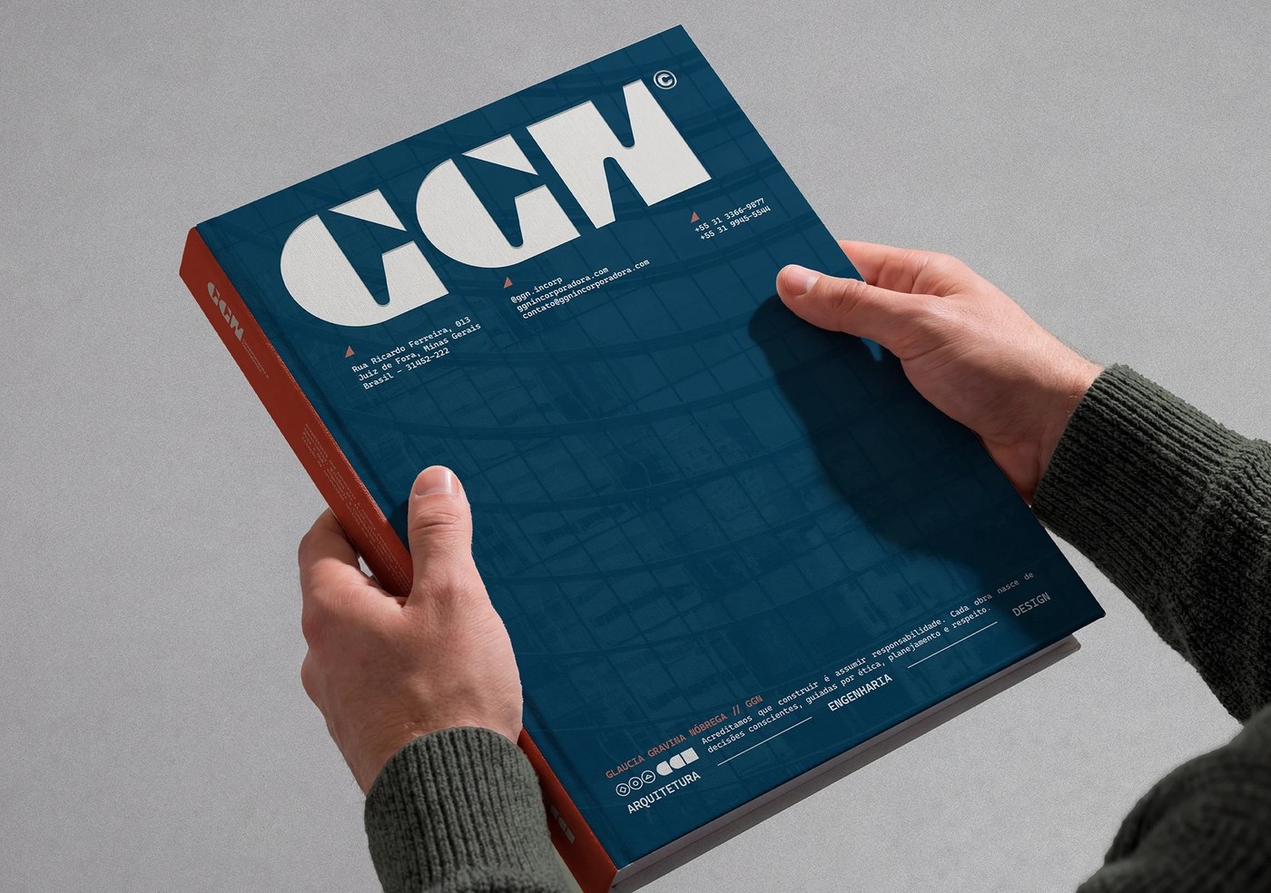 GGN hardcover brand manual book in petrol blue with white logotype