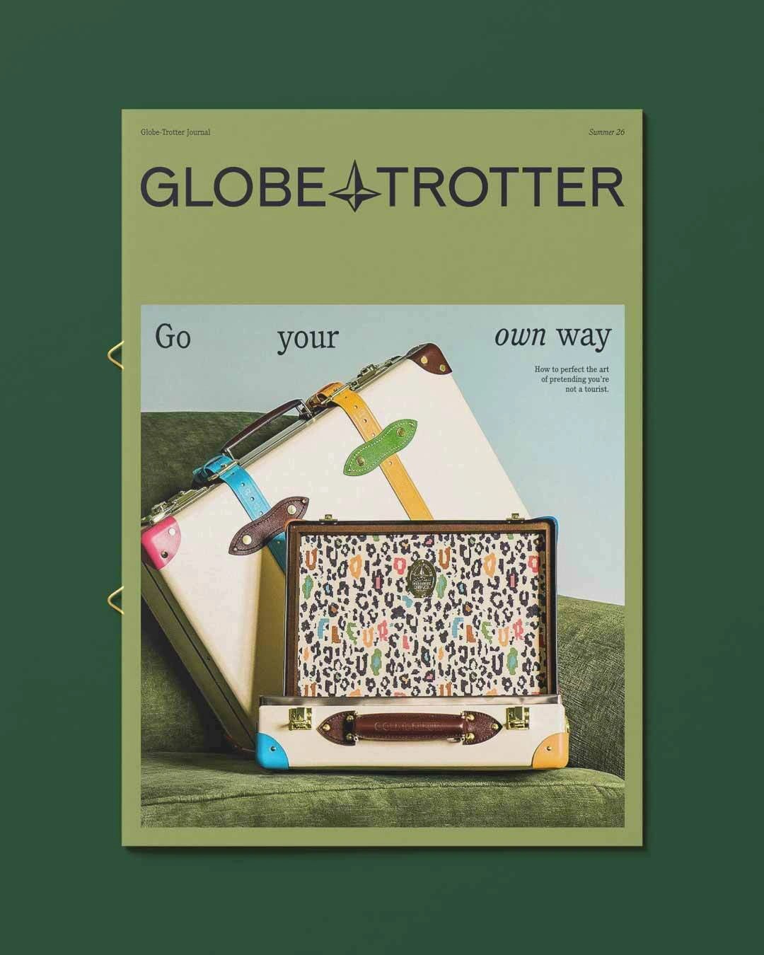 Globe-Trotter Journal Summer 26 brand board and print collateral suite flat lay featuring the North Star logo wordmark, typography pairing, and pastel luggage cases — brand identity by Ragged Edge