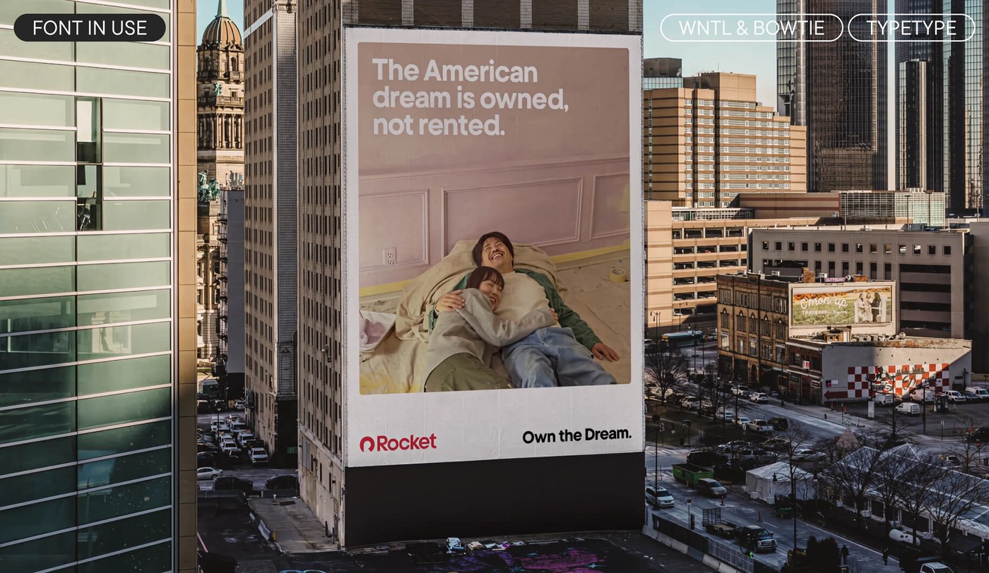 Downtown skyscraper architectural wall billboard featuring WNTL typography design for Rocket