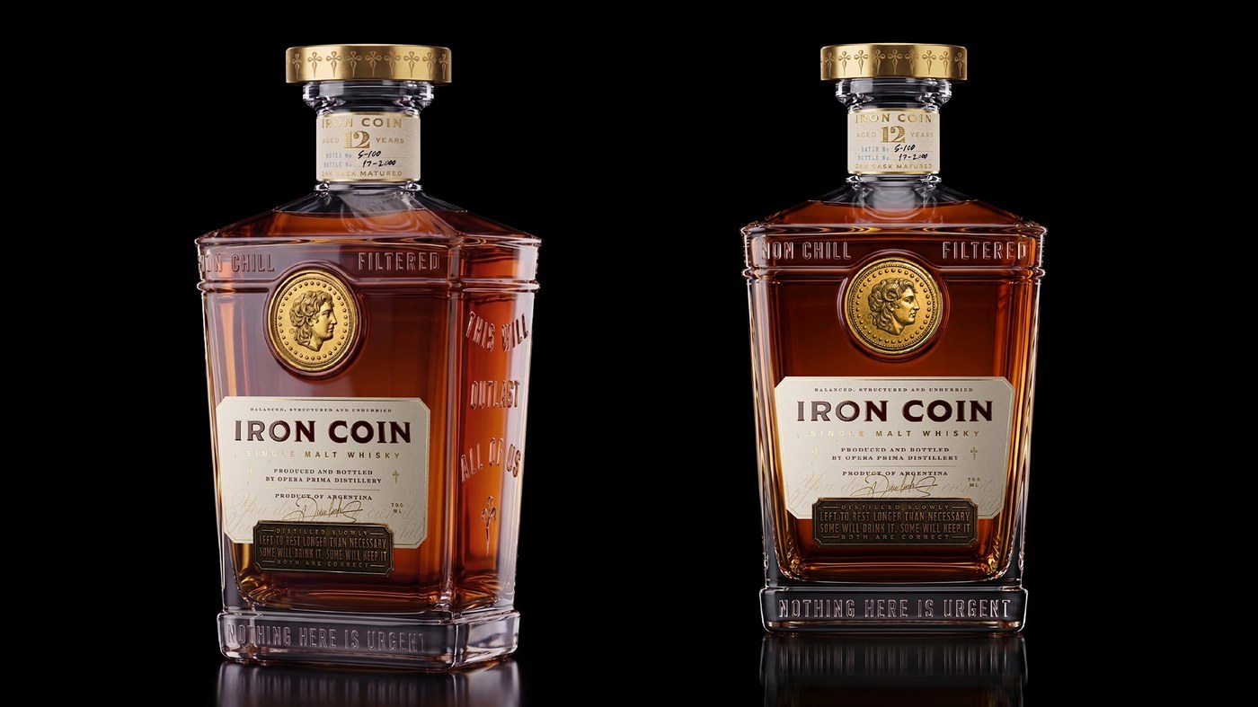 Studio perspective and front views of the faceted flint glass bottle showing embossed mottos — packaging design by Opera Prima