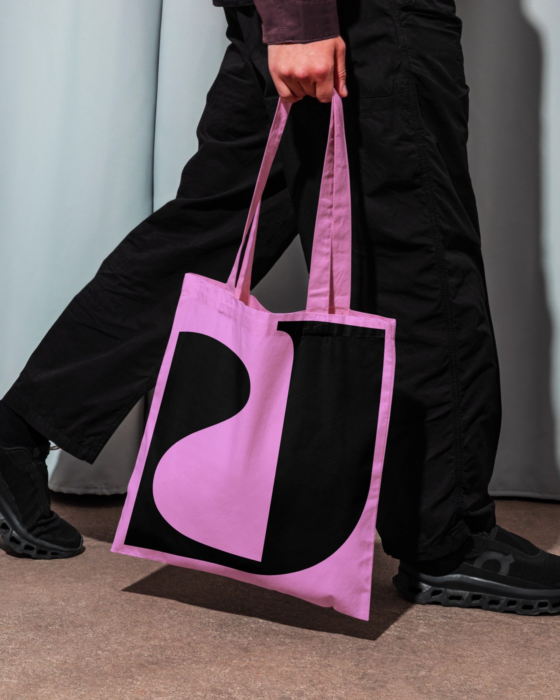 Screenprinted canvas tote bag with bold organic J letterform monogram