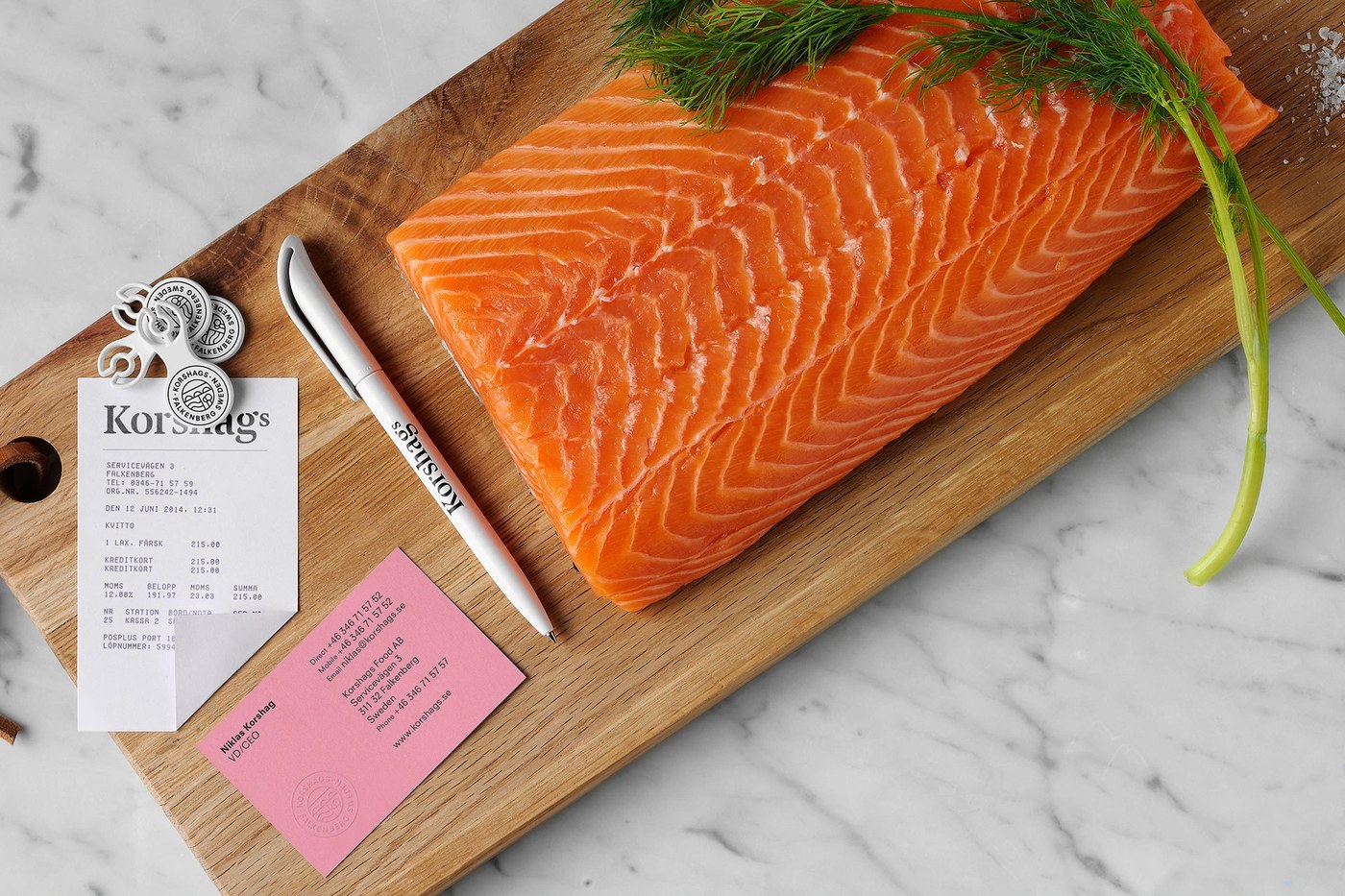 Fresh salmon fillet and printed collateral in packaging design by Kurppa Hosk