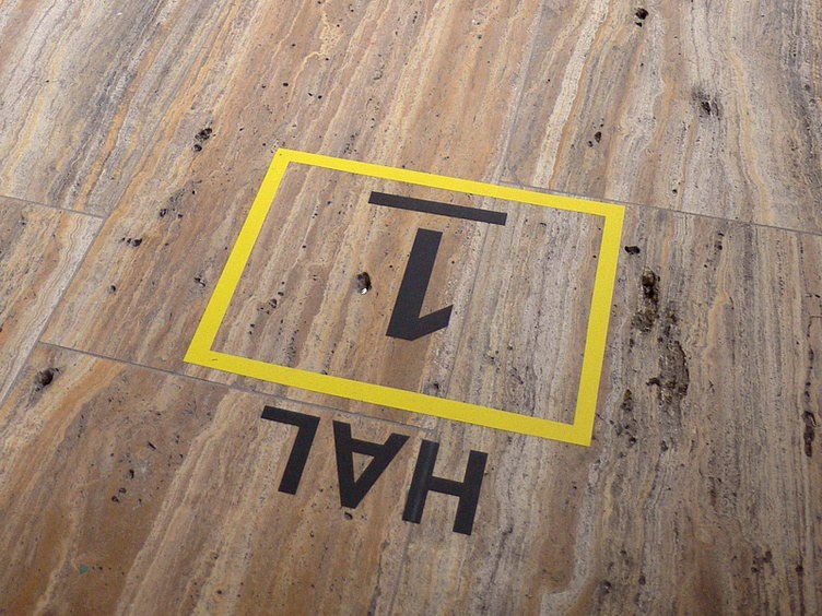 Kunsthal Rotterdam signage wayfinding system verena tam directional arrows on column