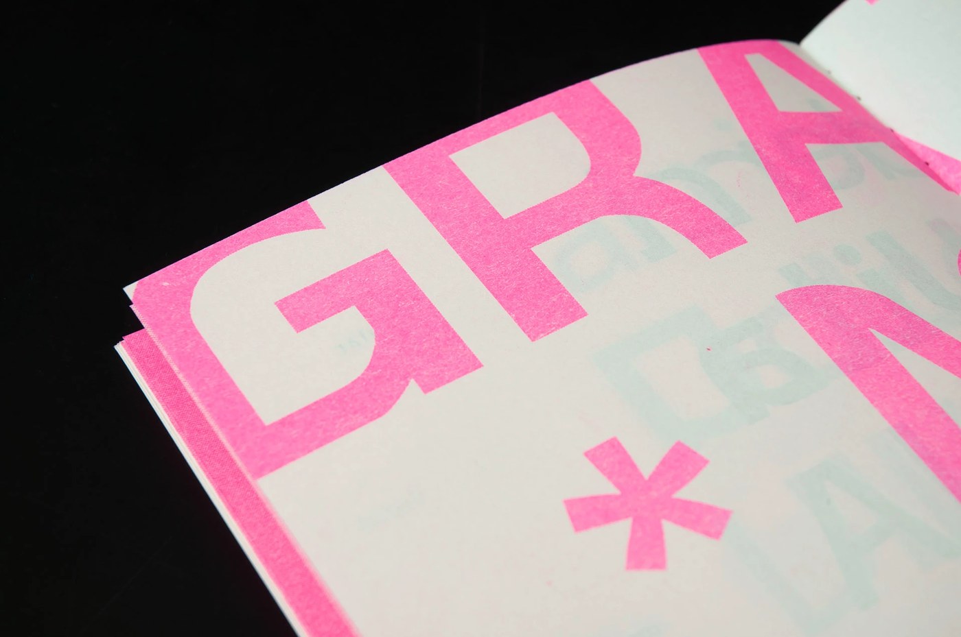 Overlapping typography details in variable typeface specimen risograph print design booklet