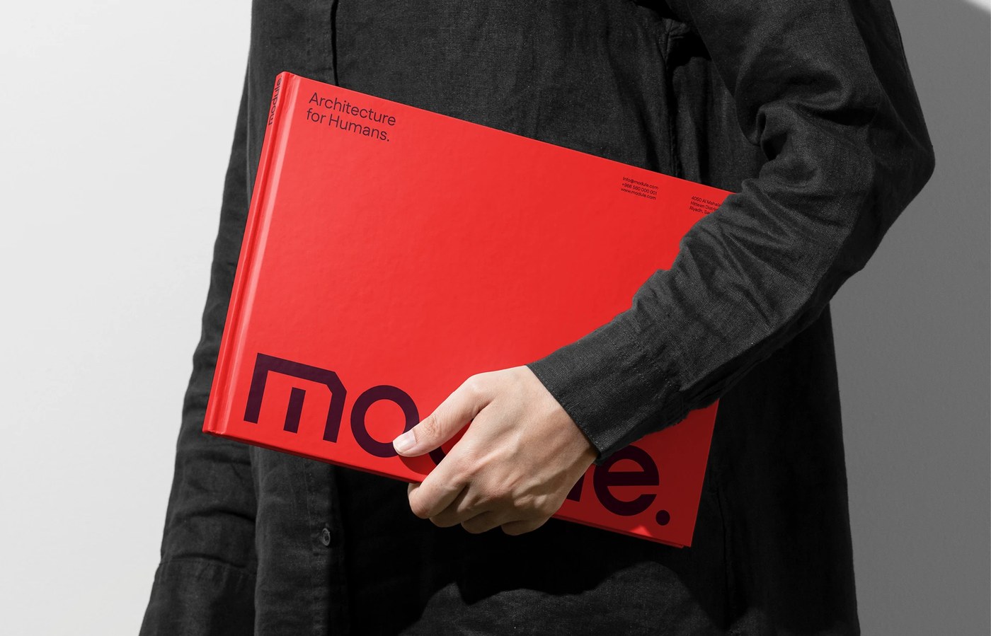Module master brand identity presentation binder book with red hardcover and dark purple logotype