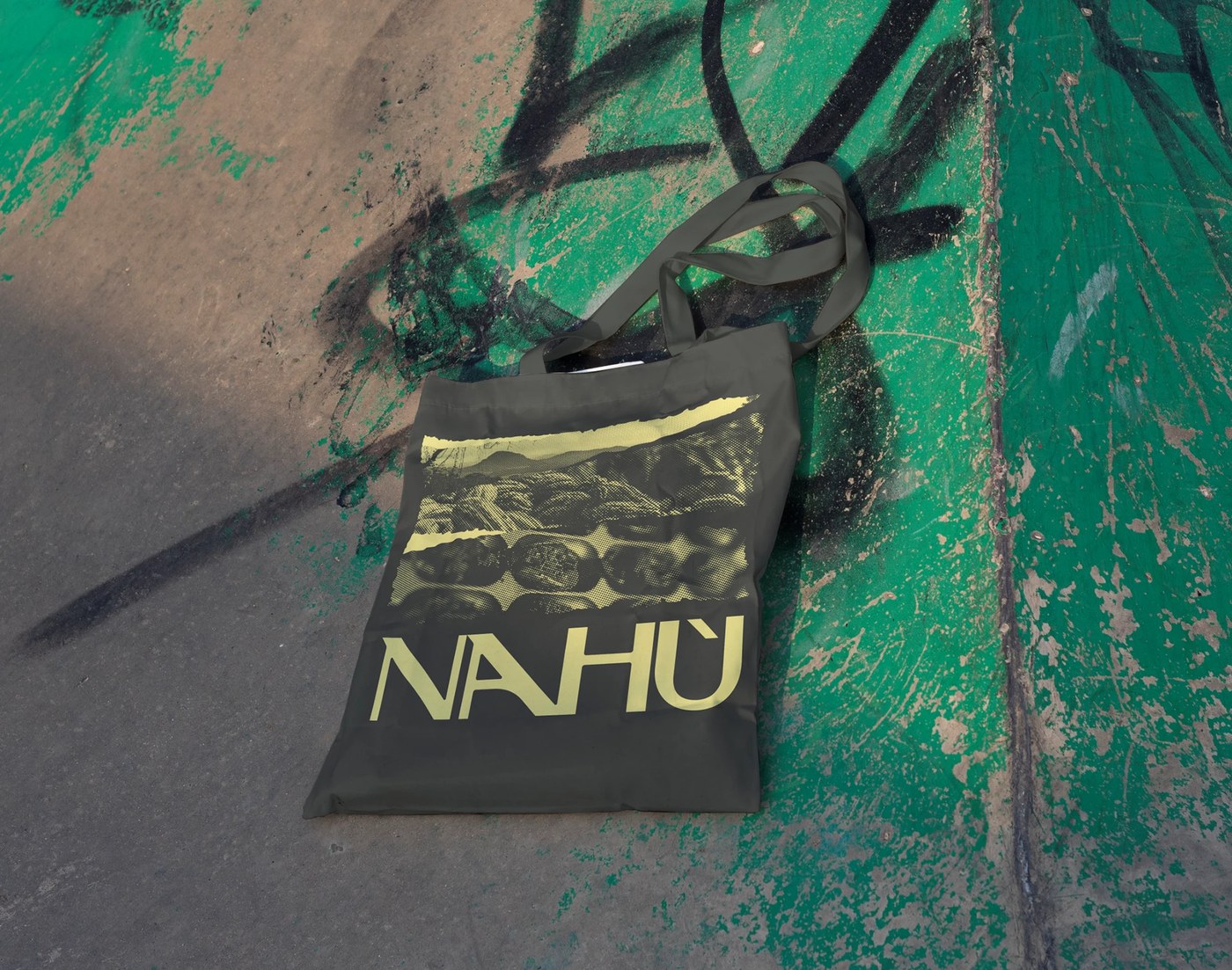 Screenprinted cotton tote bag on weathered concrete — branding design by Brand Brothers