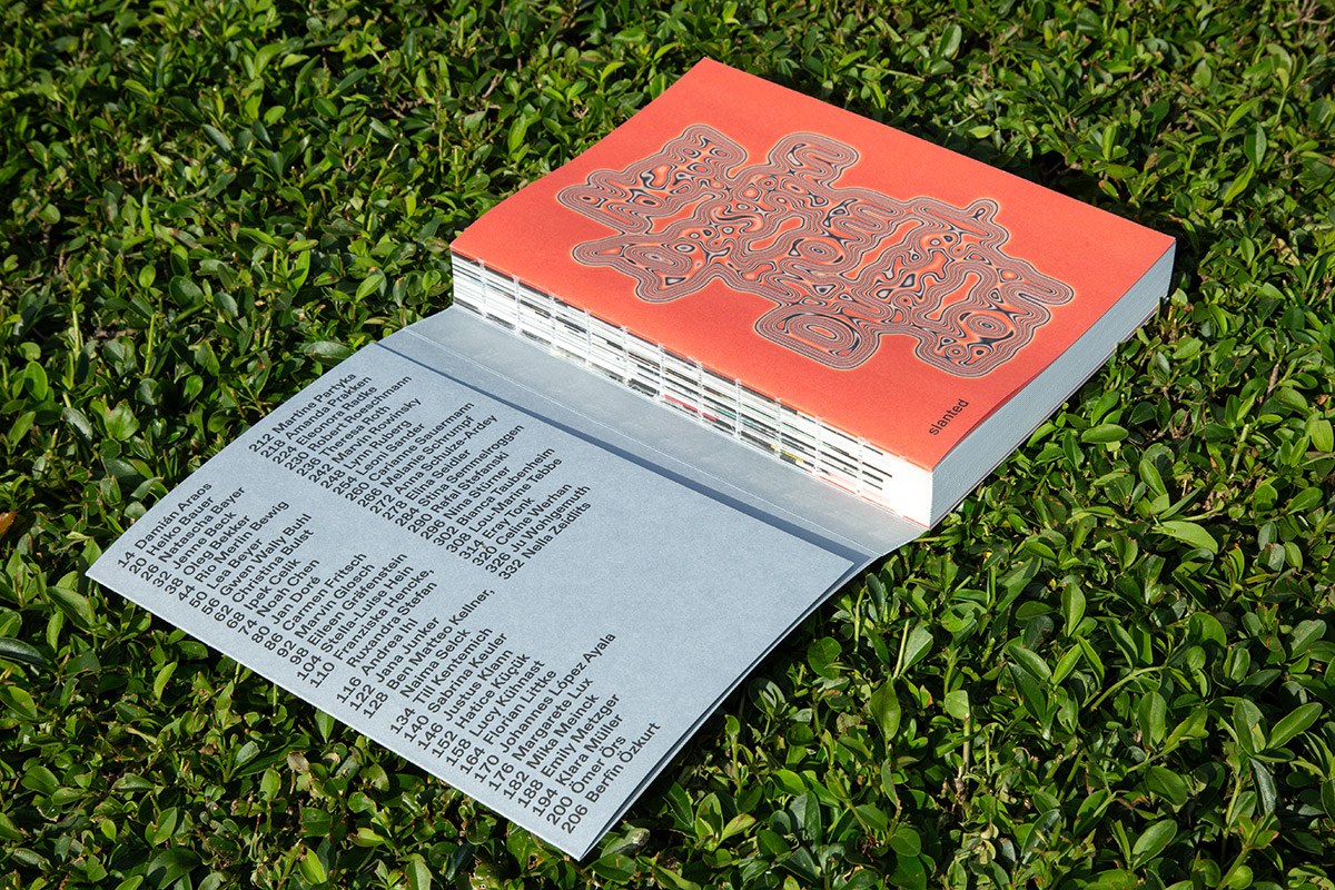 Back cover coral-red spread — graphic design book New Design from Düsseldorf 2026