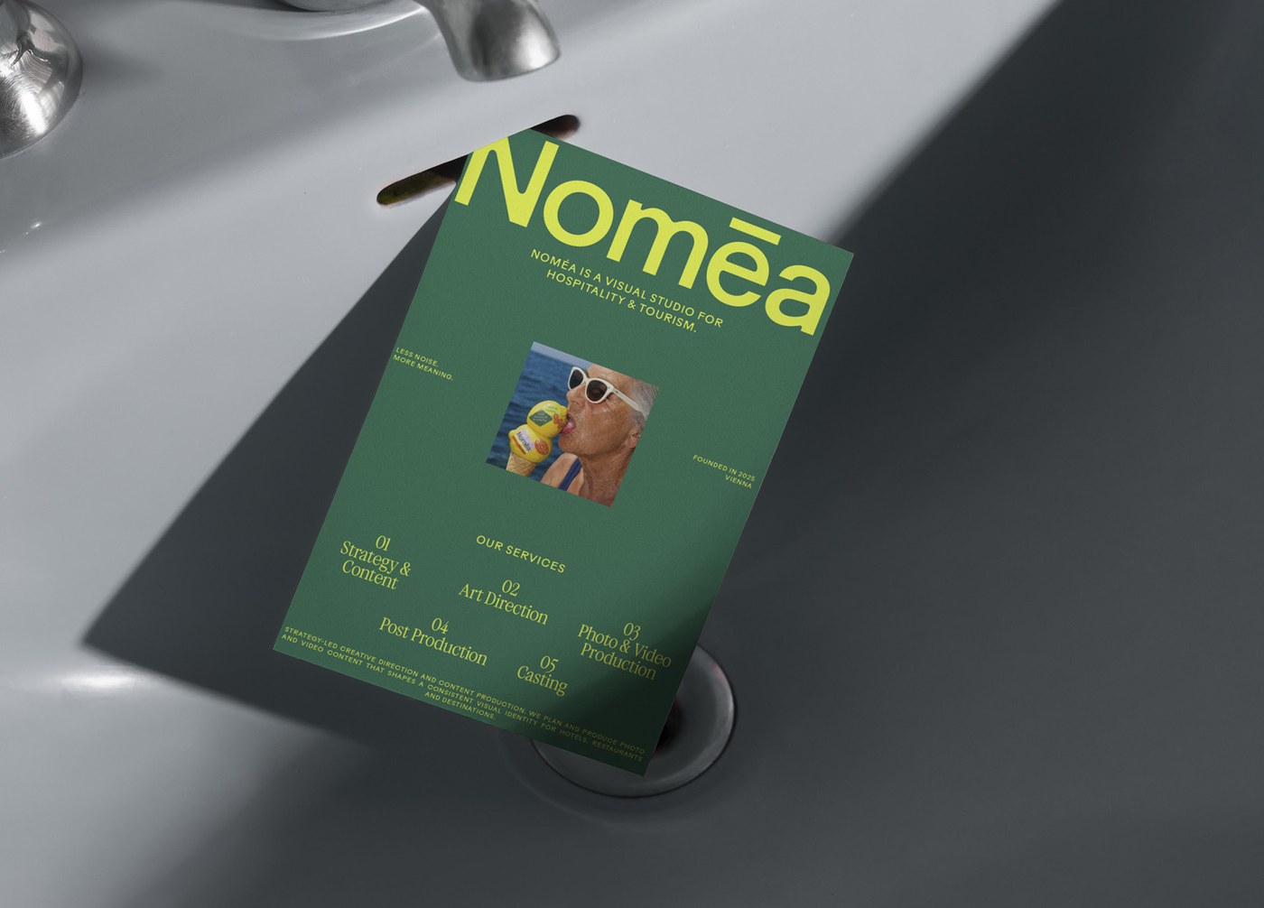 Nomēa Studio emerald green service brochure card branding