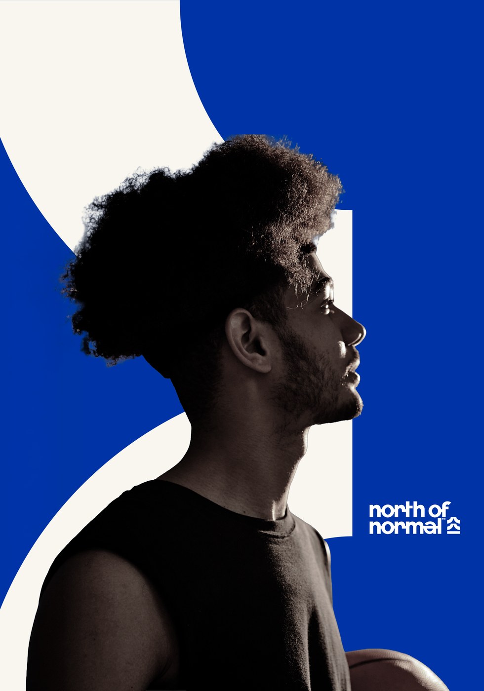 Basketball player profile against cobalt blue backdrop featuring North of Normal branding design