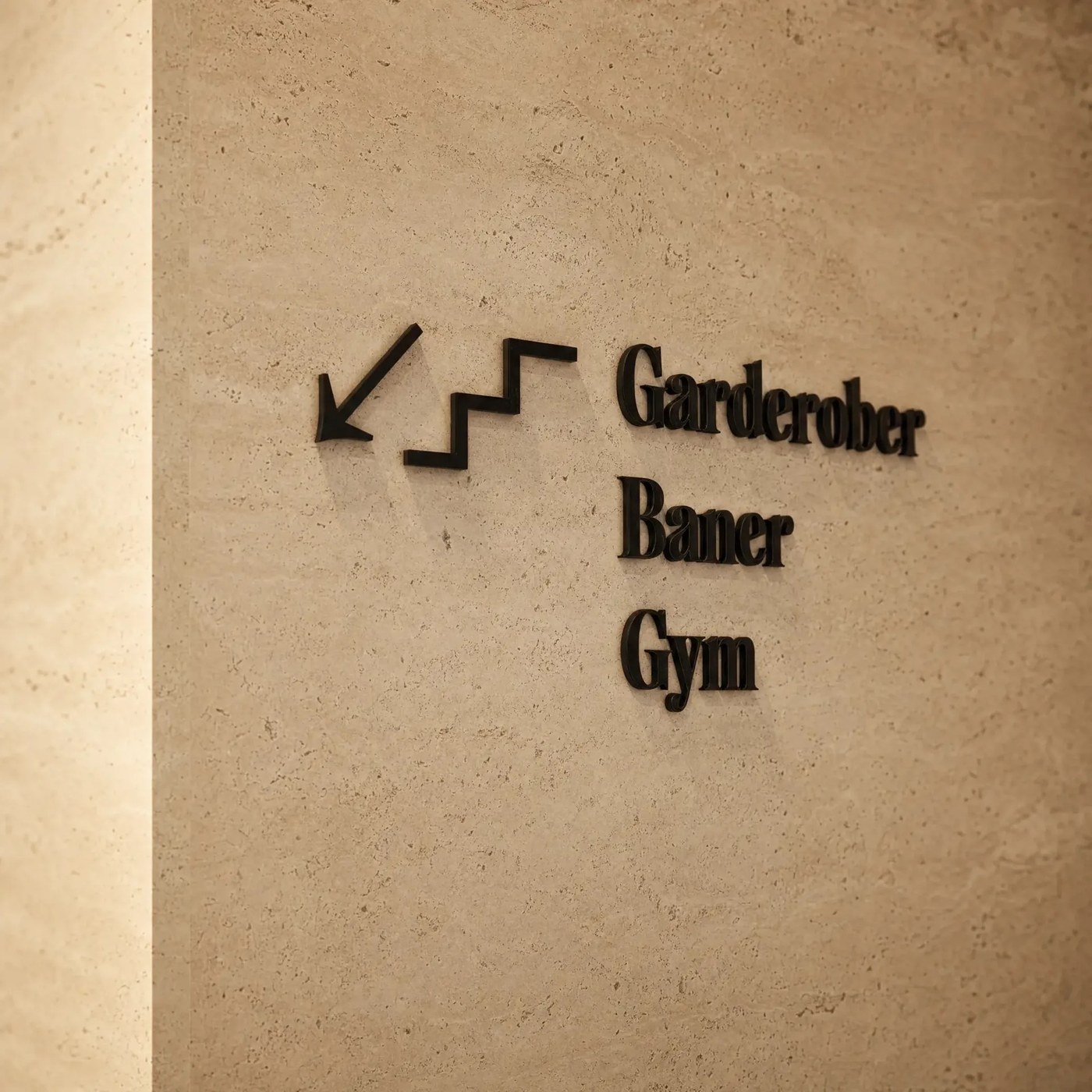 Directional stone signage for the changing rooms, courts and gym — brand identity by Garcy Studio
