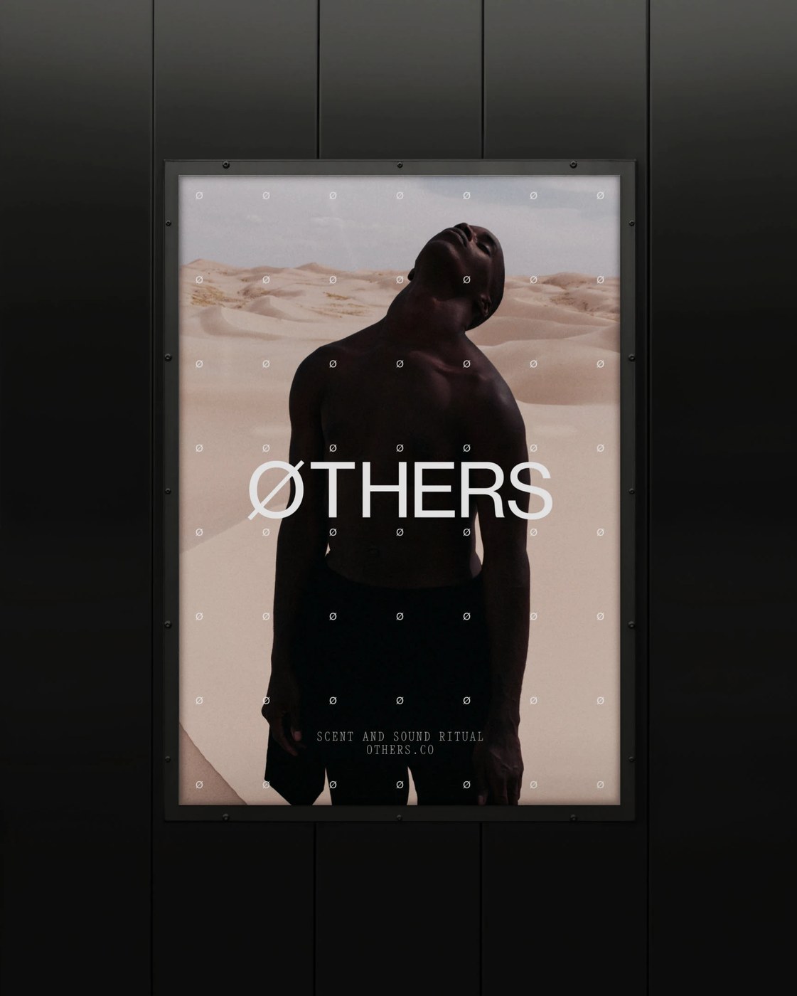 Outdoor framed poster spread with white ØTHERS logotype and dune portrait in editorial design by Two Times Elliott