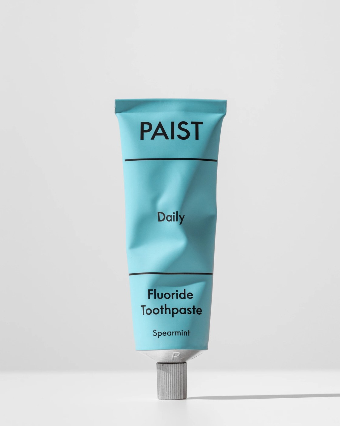Paist Daily fluoride toothpaste aluminum tube in sky blue with ridged metal cap