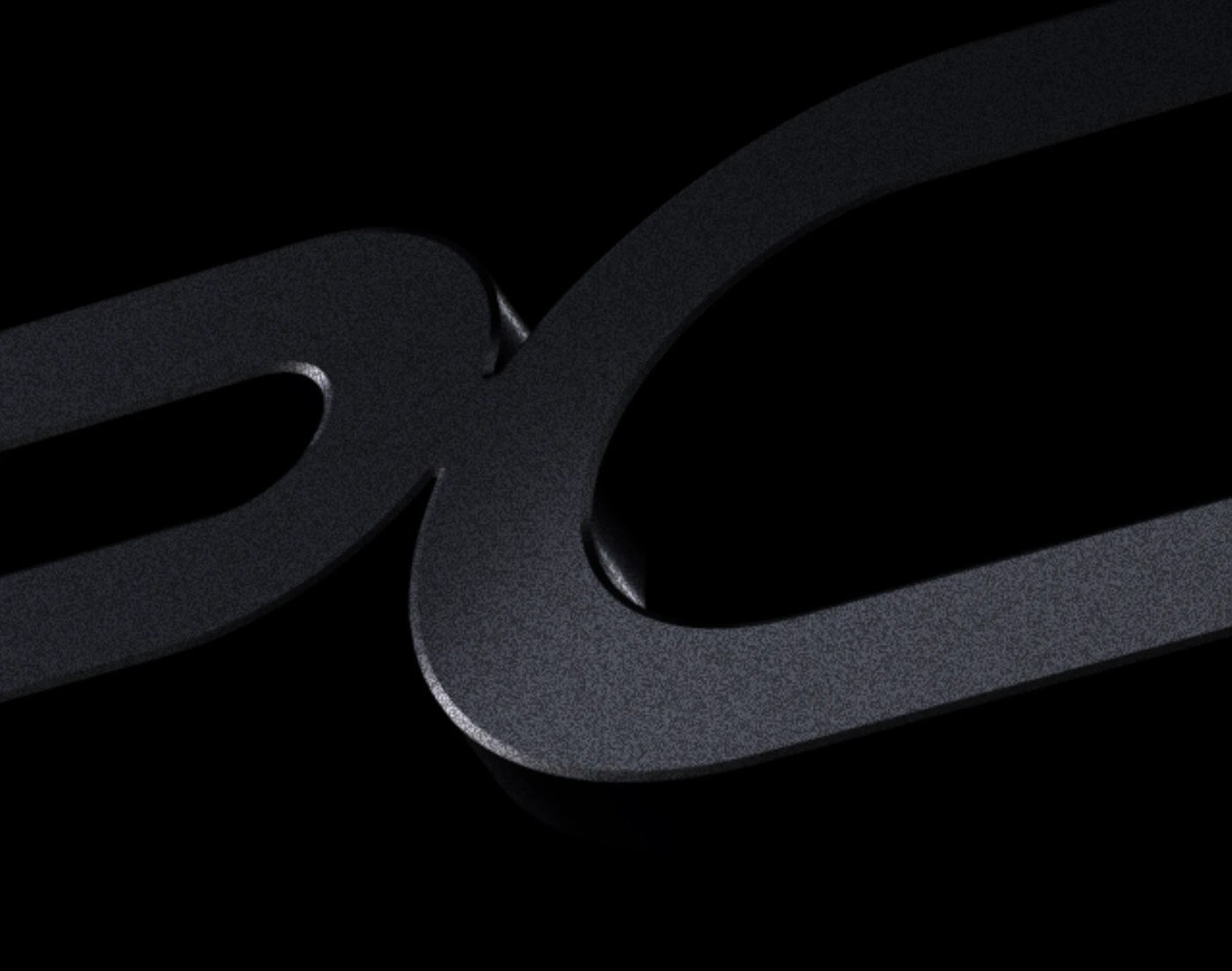 Sculptural macro curves and chamfered details of the PCK letterforms