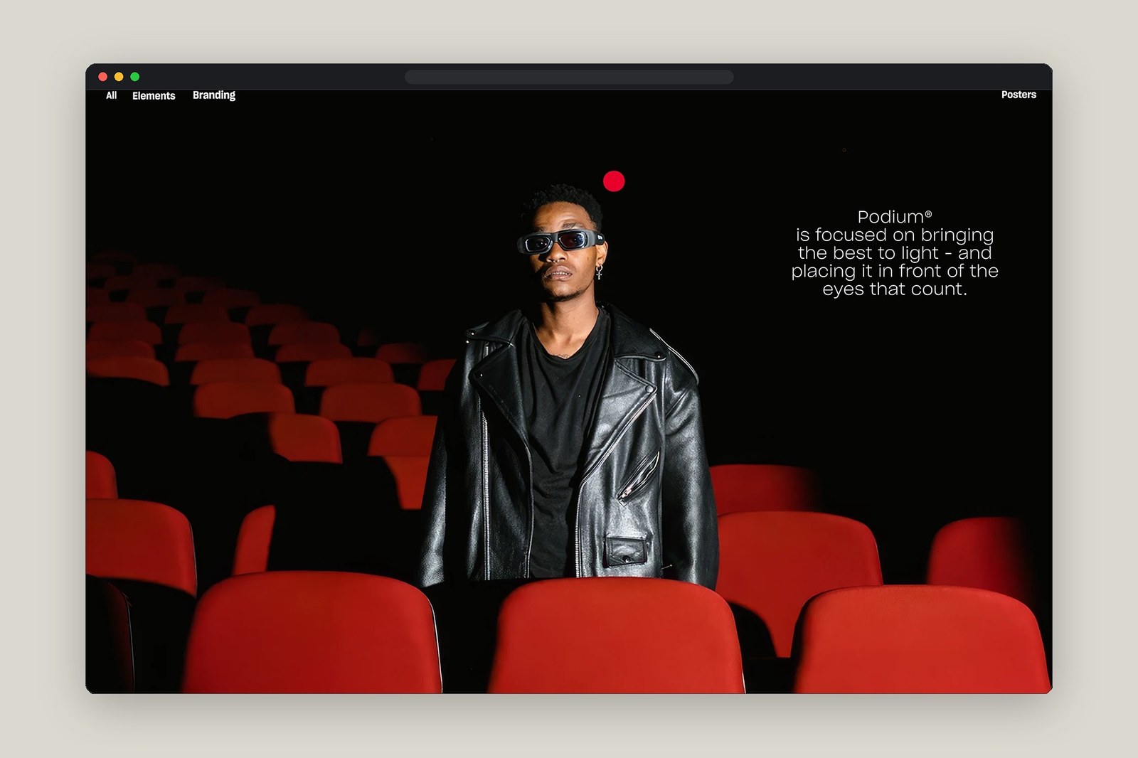 Podium website hero viewport with red spotlight dot over dark cinema seats and navigation header by Humbleteam