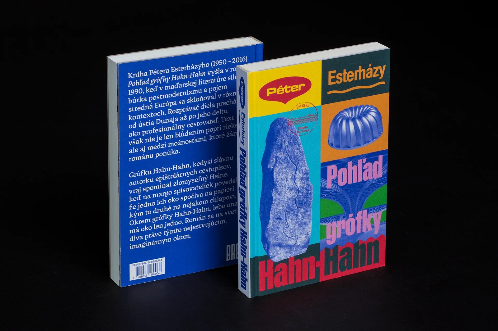 Two standing copies displaying the cobalt-blue back cover typography and color-blocked front book design by Matúš Hnát