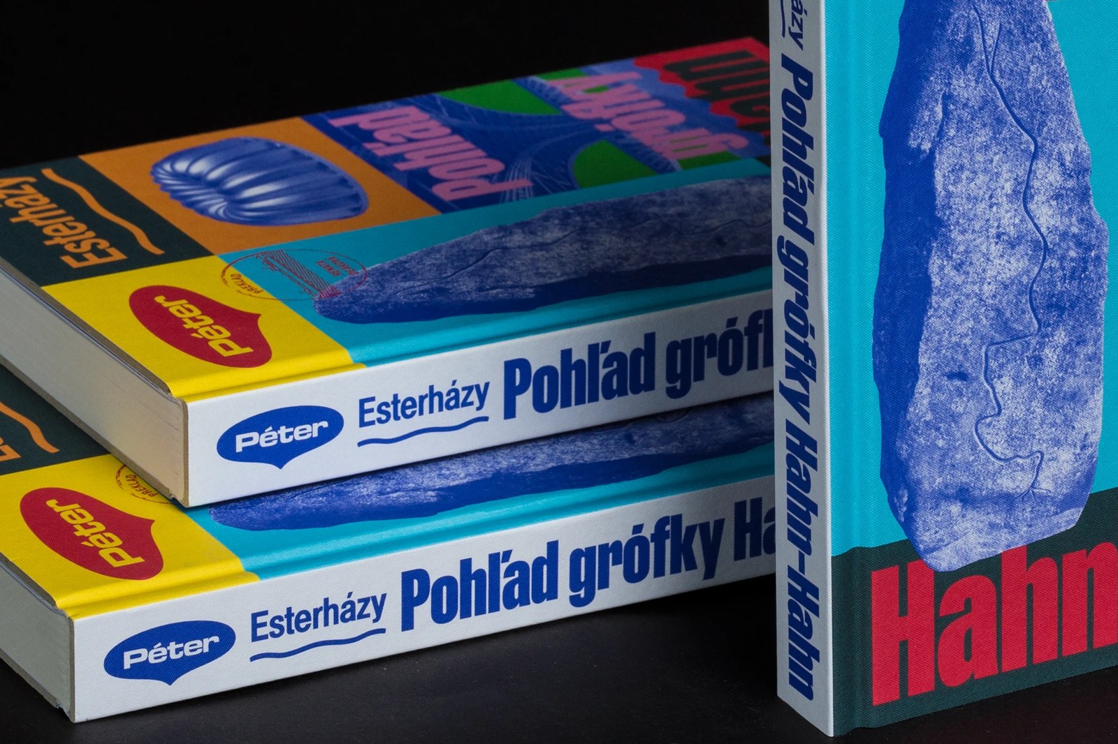 Close-up of the spine lockup and crimson Hahn-Hahn condensed grotesk typography in Matúš Hnát's book design
