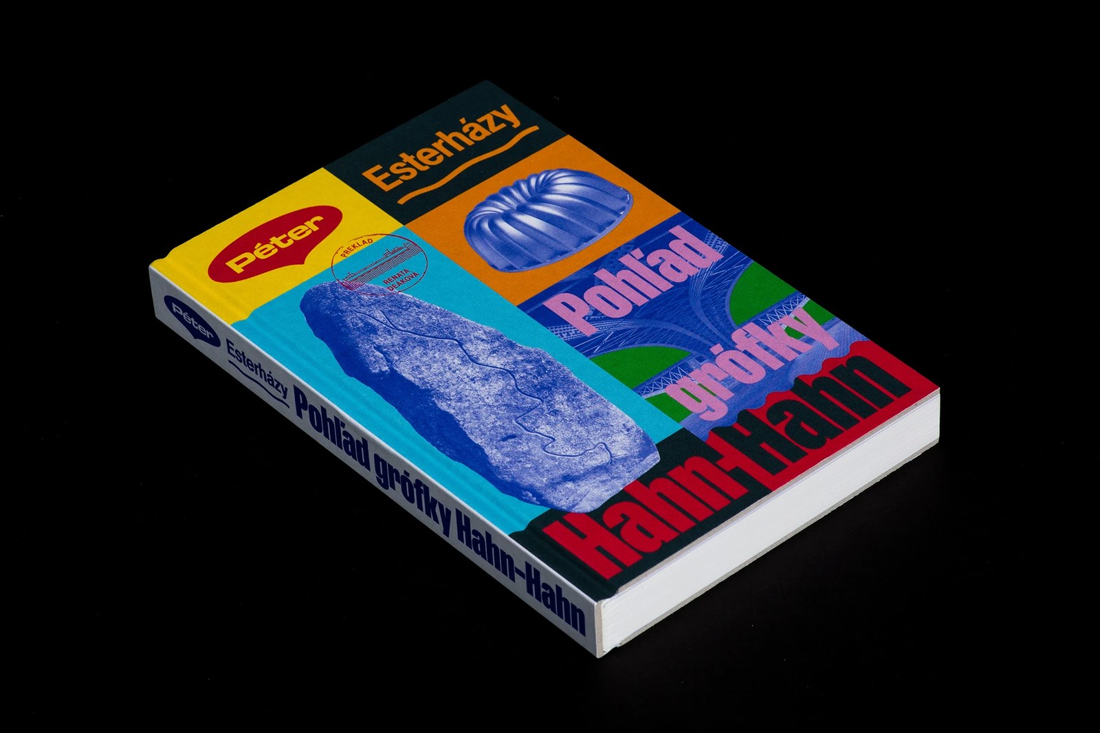 Three-quarter studio view of Péter Esterházy's The Glance of Countess Hahn-Hahn book design showing the fluted Gugelhupf mold and bridge trusses