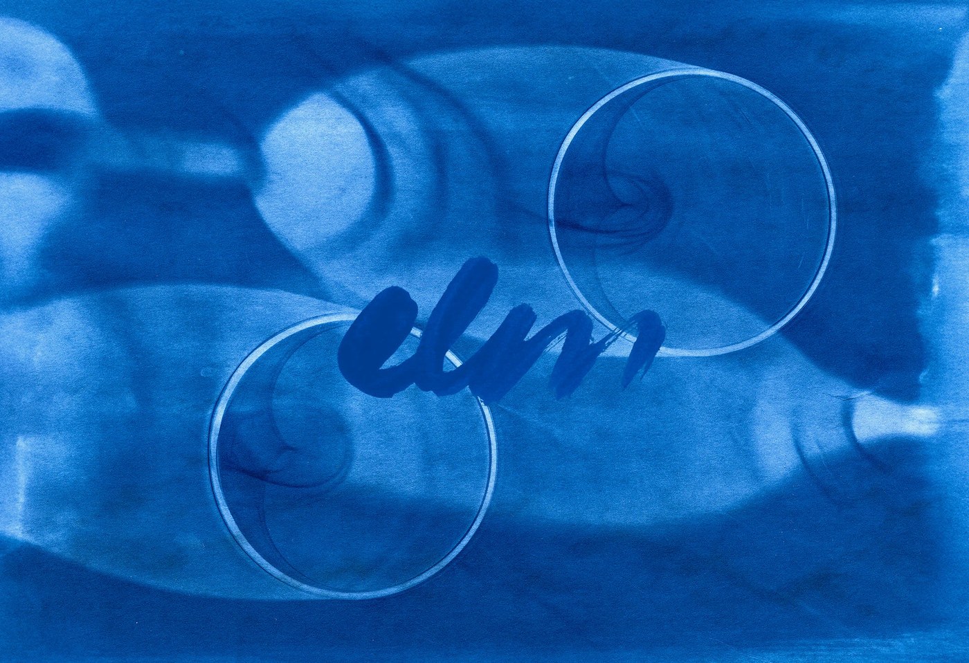 Handcrafted cyanotype print of wine glasses with the painterly Elm brushstroke wordmark