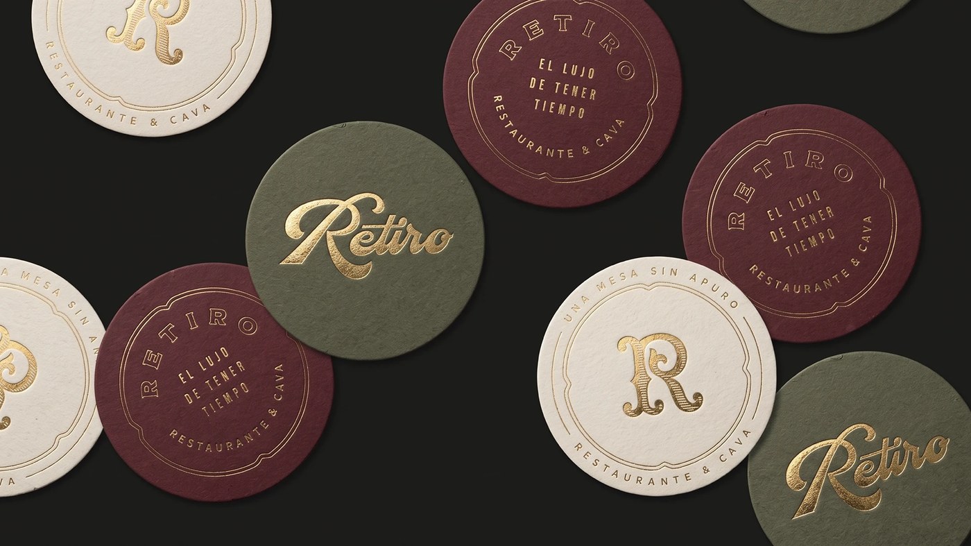 RETIRO branding design custom metal token and dining room artifact
