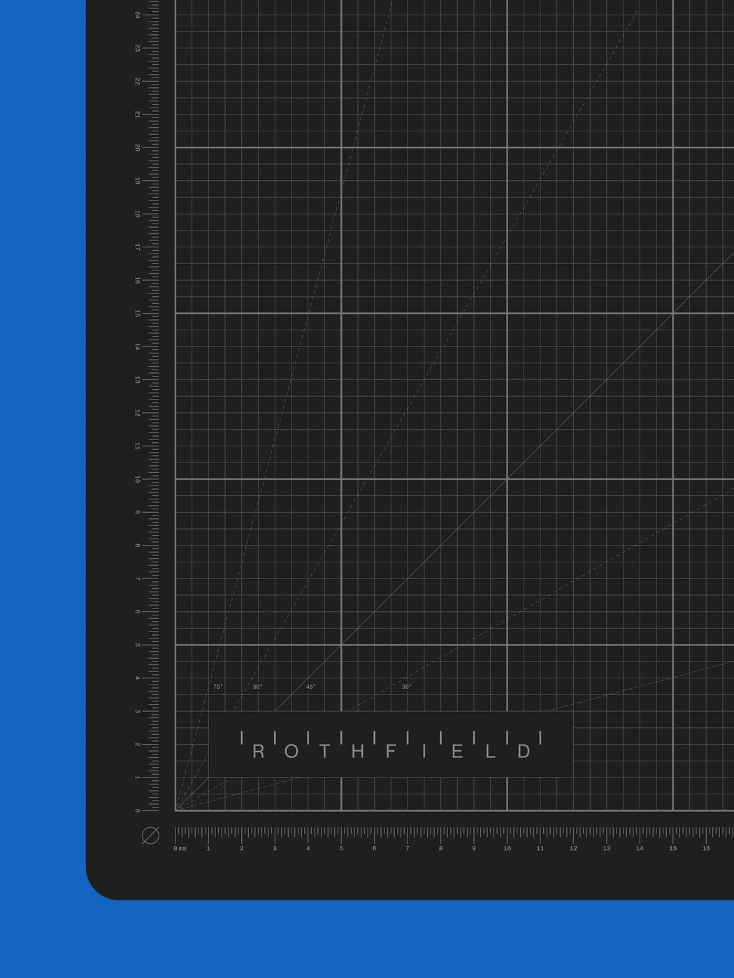 Dark precision drafting cutting mat with angle guides and millimeter calibration grid over a cobalt blue surface