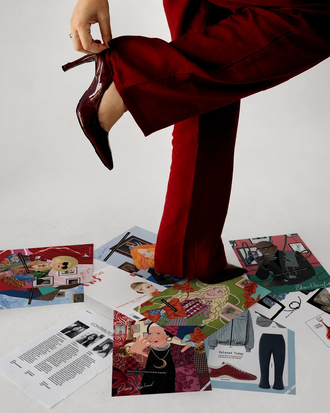 Printed Mix Patterns editorial illustration cards fanned across studio floor with patent stiletto heels