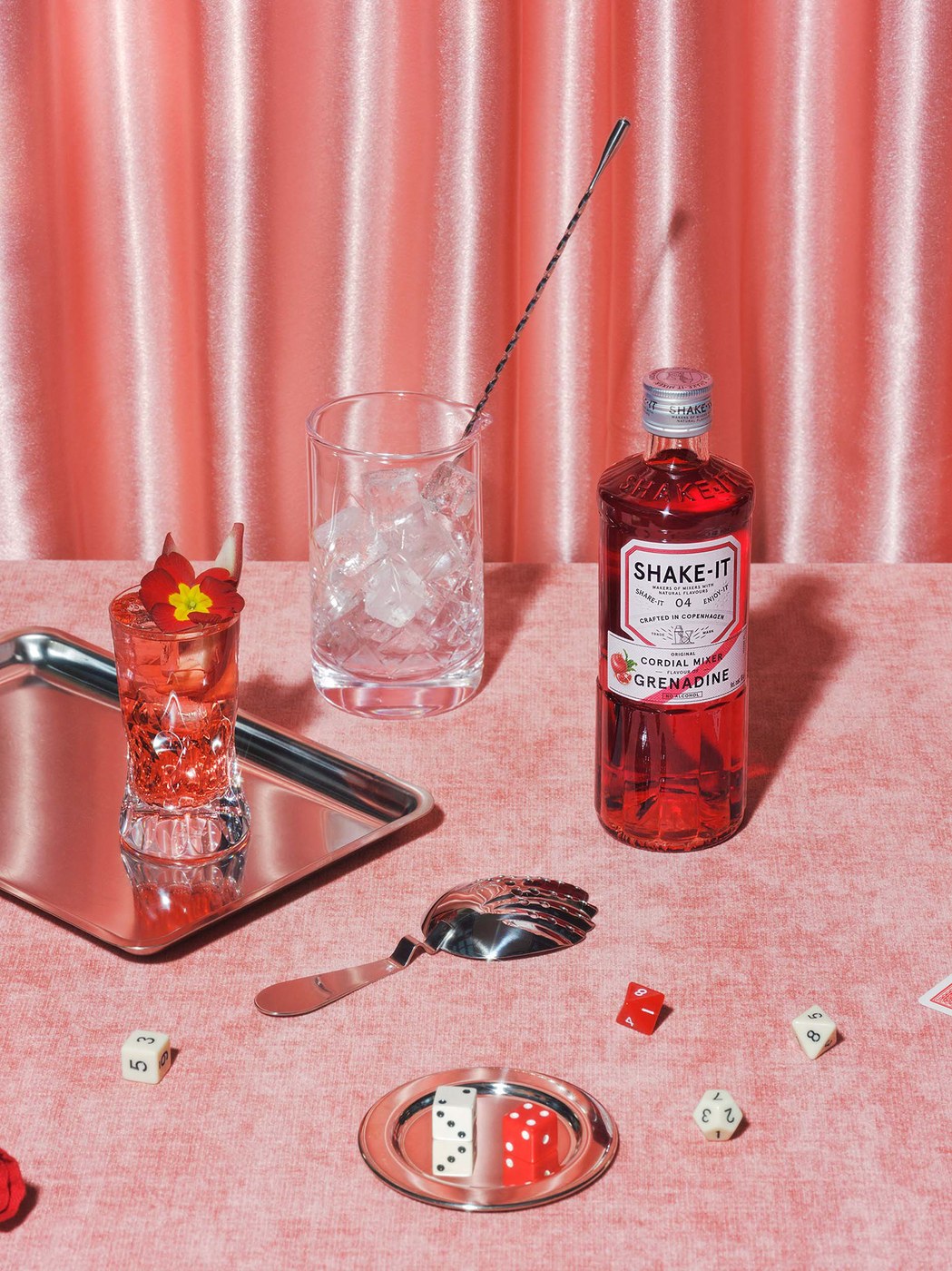 Shake-it Grenadine bottle and cocktail setting in packaging design by OlssønBarbieri
